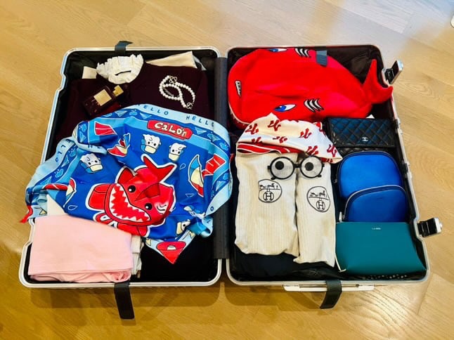 Chị Trang Nguyễn chuẩn bị hành trang với nhiều món đồ của nhà Cá Lớn trong chương trình Anh trai vượt ngàn chông gai. Ảnh: Nhân vật cung cấp