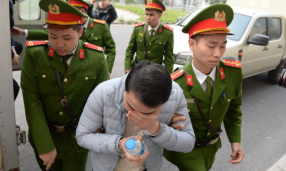 Một bị cáo bị tạm giam khác liên quan trong vụ án chuyến bay giải cứu. Ảnh: Quang Việt